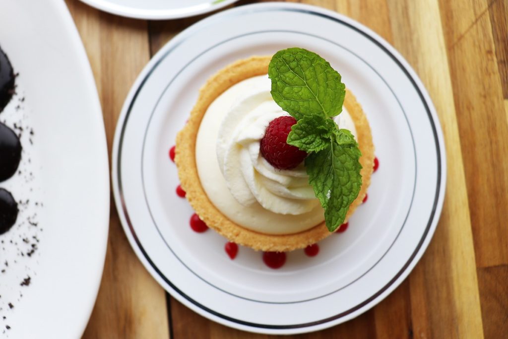 Philadelphia Cheesecake, No-bake recipe with whipped cream and fresh raspberries